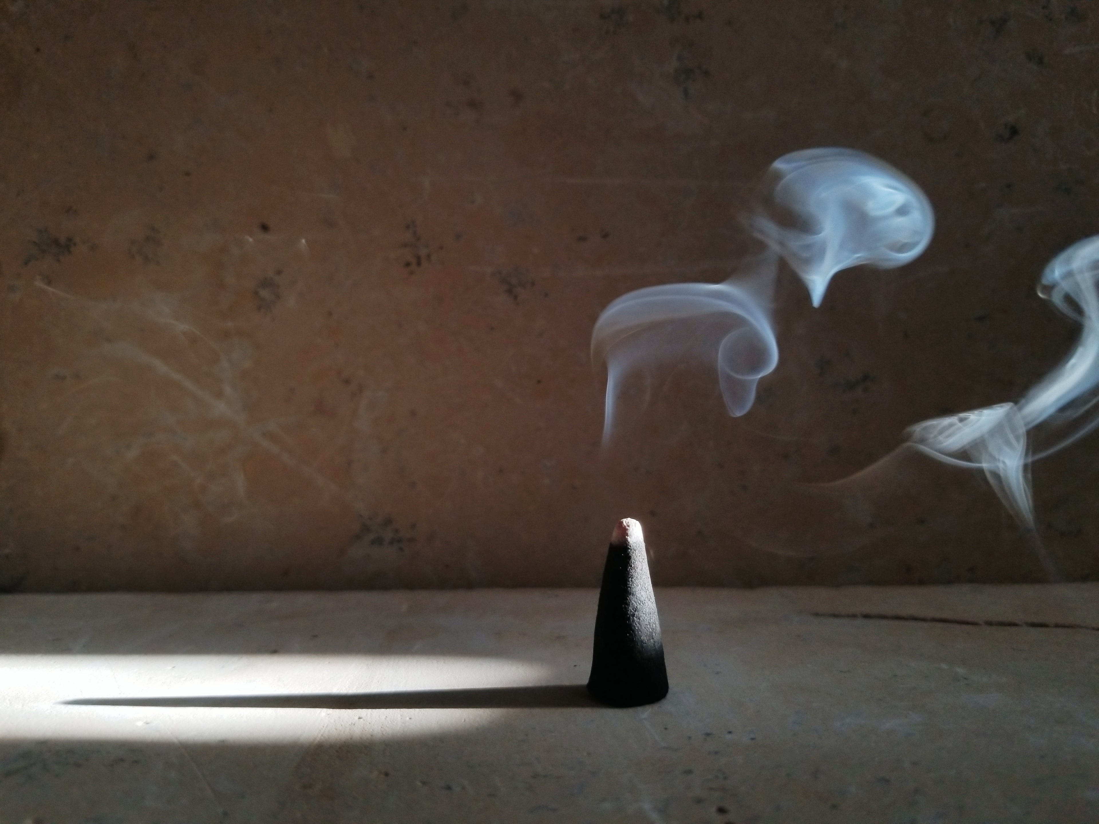 burning incense cone at Genara