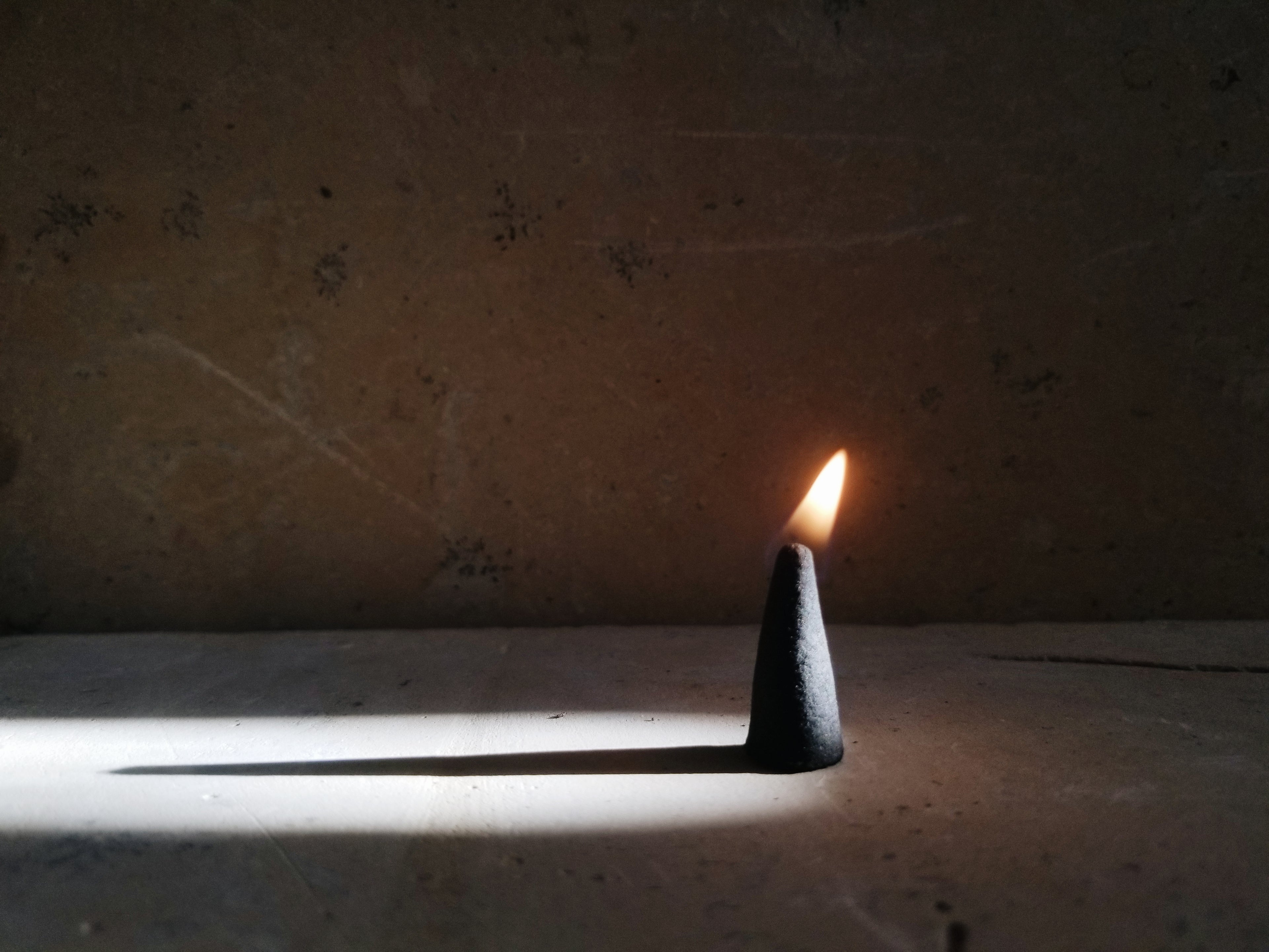 burning incense cone at Genara